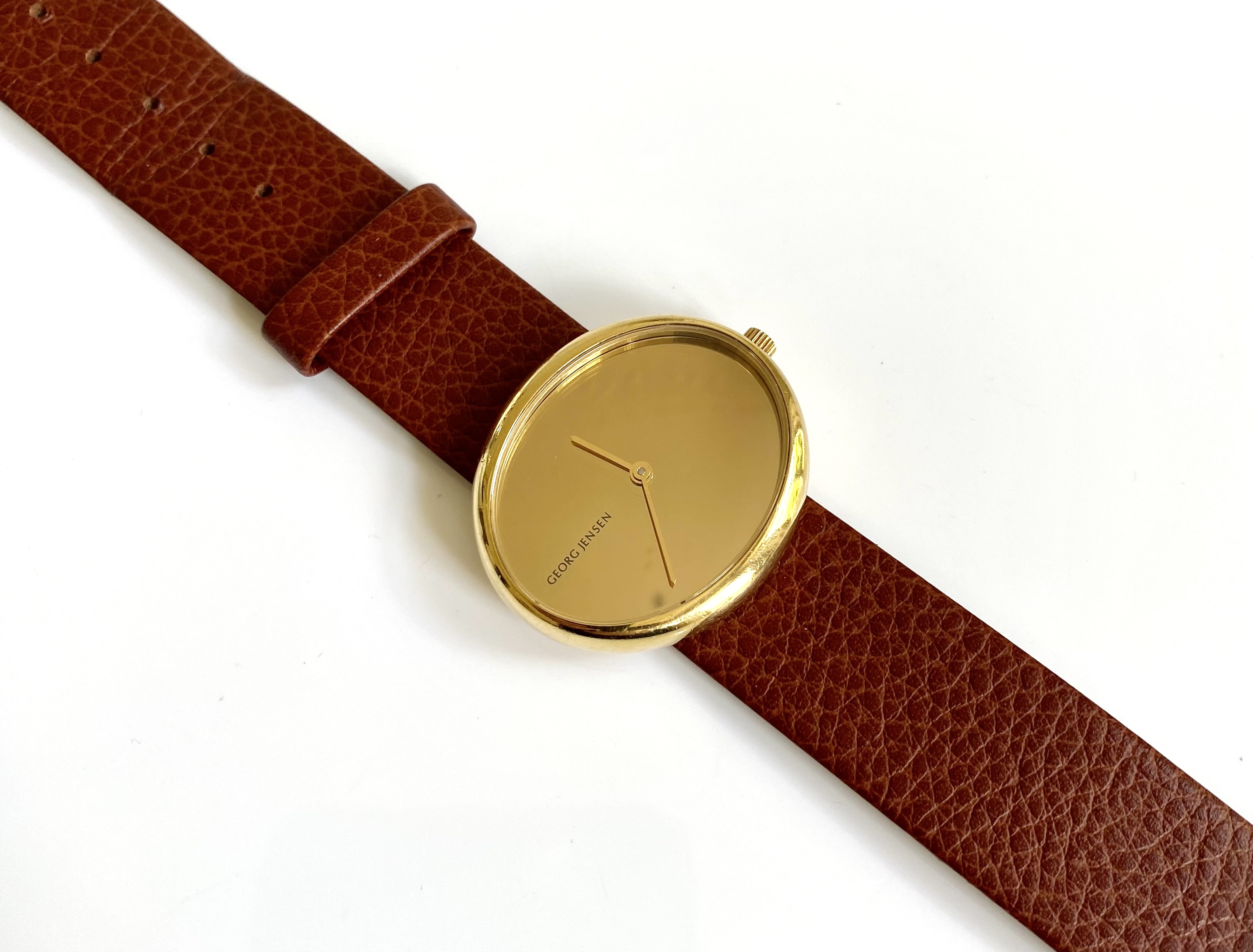 Discover the exquisite Georg Jensen Torun 18K Gold Watch, a masterpiece of Danish design that combines luxury and functionality. Perfect for any occasion, this elegant timepiece offers unmatched style and precision. Shop now to own a piece of innovative craftsmanship.