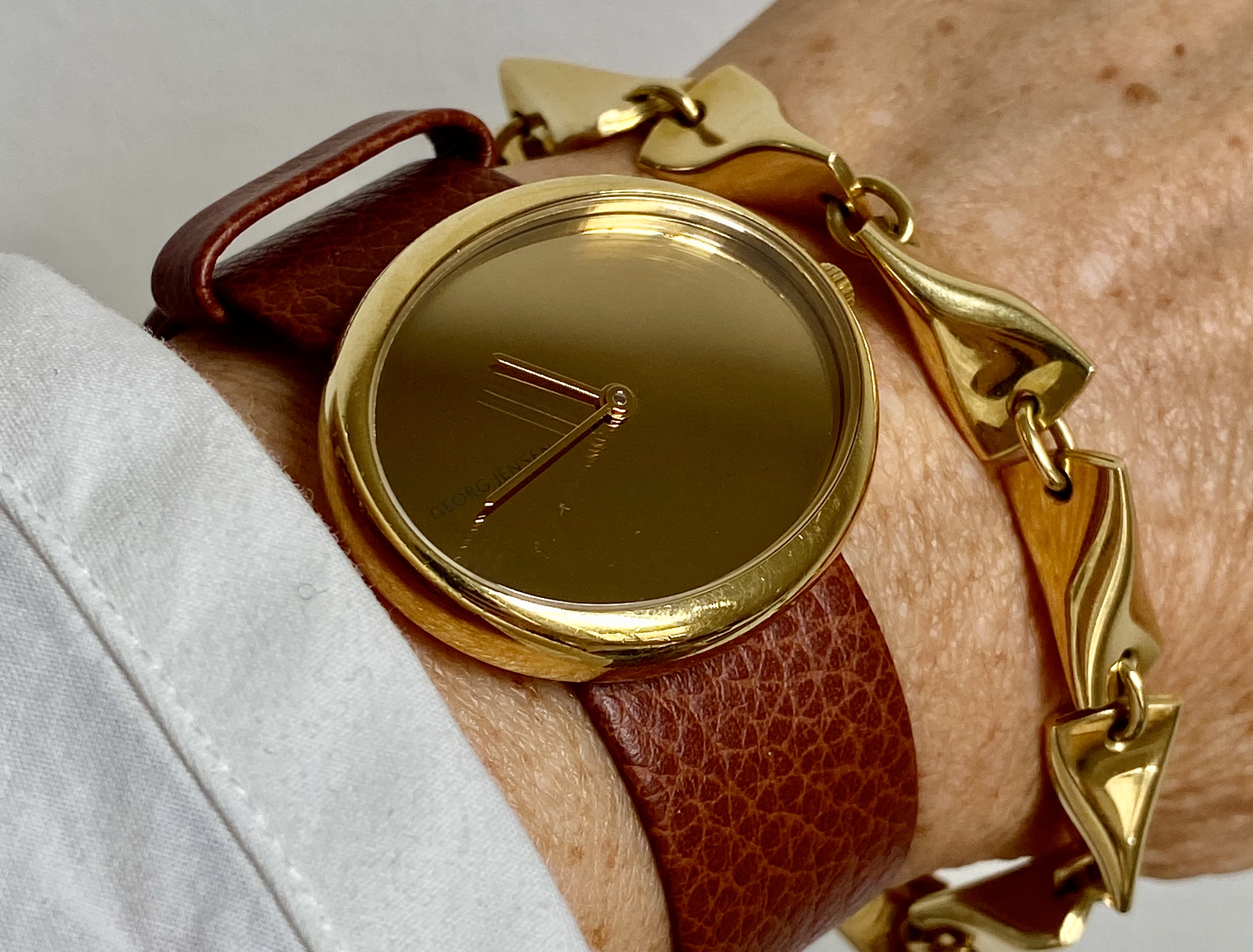 Discover the exquisite Georg Jensen Torun 18K Gold Watch, a masterpiece of Danish design that combines luxury and functionality. Perfect for any occasion, this elegant timepiece offers unmatched style and precision. Shop now to own a piece of innovative craftsmanship.