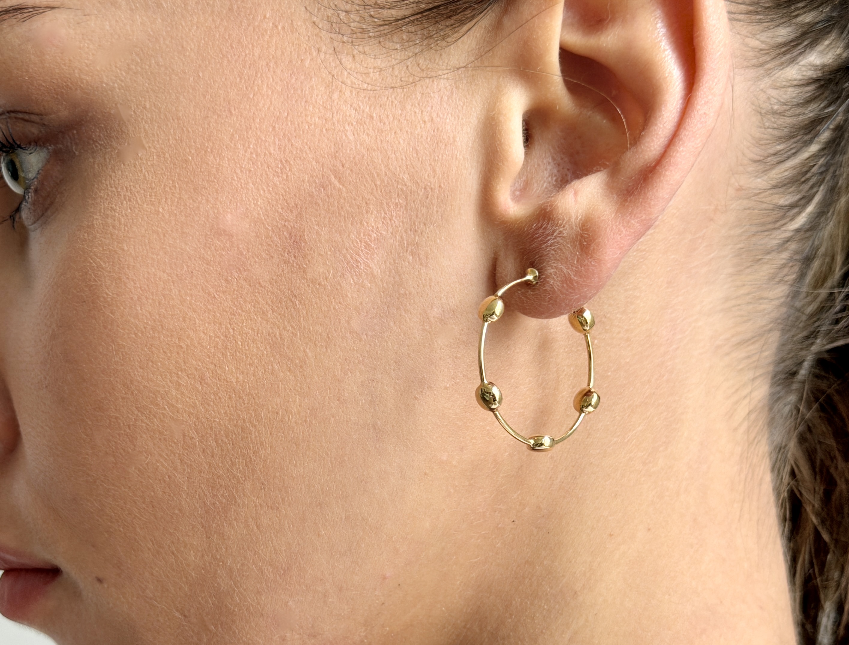 Shop the exquisite Georg Jensen 18K Gold Hoop Earrings. Crafted from high-quality gold, these earrings offer a perfect blend of sophistication and style, ideal for any occasion. Elevate your jewelry collection with this timeless accessory.