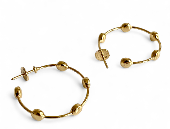 Shop the exquisite Georg Jensen 18K Gold Hoop Earrings. Crafted from high-quality gold, these earrings offer a perfect blend of sophistication and style, ideal for any occasion. Elevate your jewelry collection with this timeless accessory.