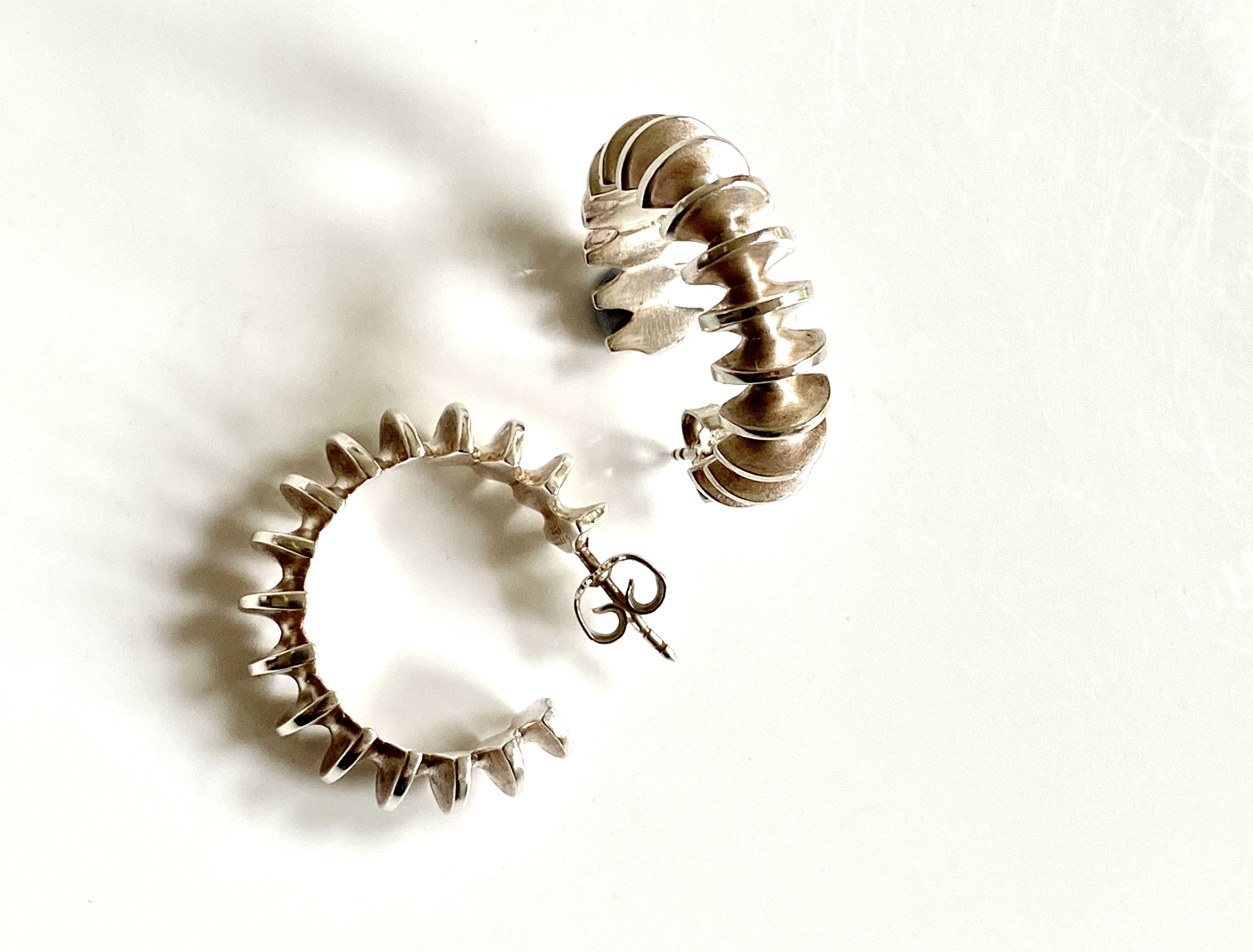 Discover timeless elegance with the Georg Jensen Clementine Silver Hoop Earrings. Designed for sophistication, these stunning earrings are perfect for any occasion. Shop now to elevate your jewelry collection!