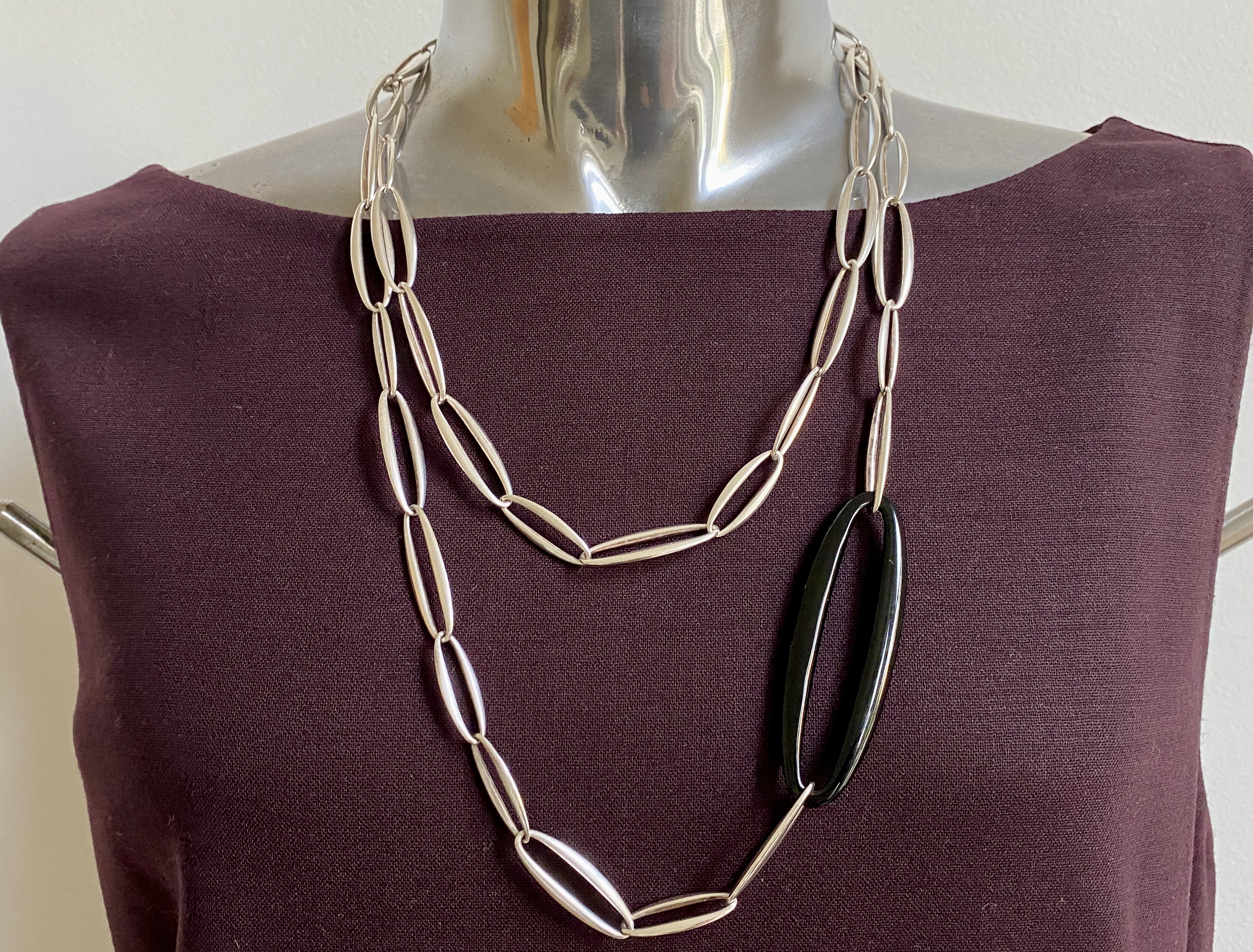 Shop the exquisite Regitz Overgaard Georg Jensen Zephyr Silver Necklace. This stunning piece features delicate craftsmanship, showcasing timeless elegance and sophistication perfect for any occasion.