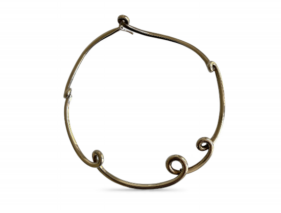 Discover the exquisite Angela Cummings Silver Neckring from 1980, a stunning statement piece that embodies timeless elegance and sophisticated craftsmanship. Perfect for any occasion.