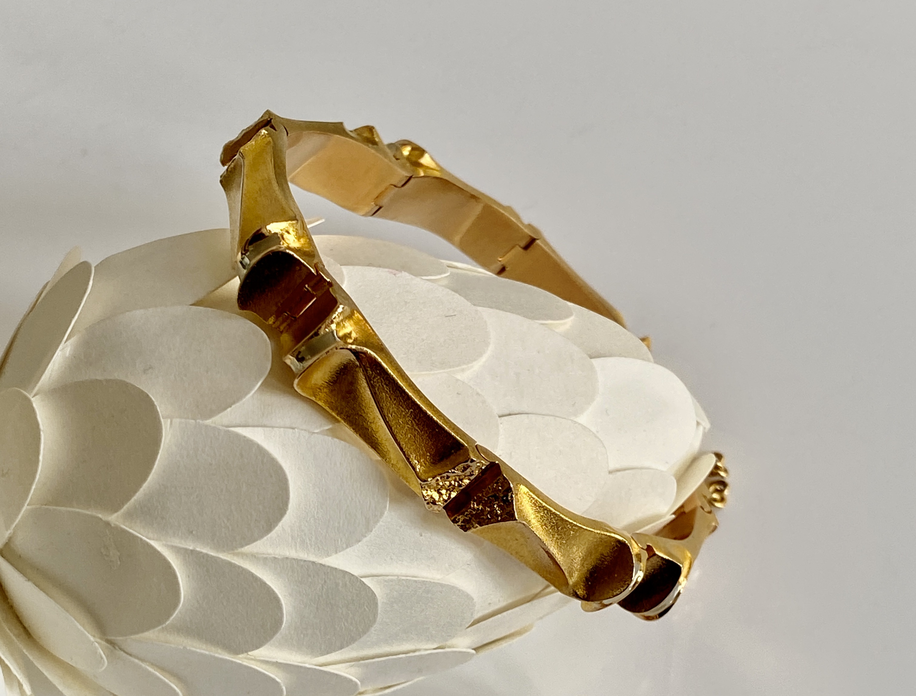 Discover the exquisite Bjorn Weckstrom Gold Bracelet, a stunning piece that embodies timeless sculptural elegance and unique craftsmanship. Perfect for any occasion, this luxurious bracelet is a must-have for jewelry collectors.