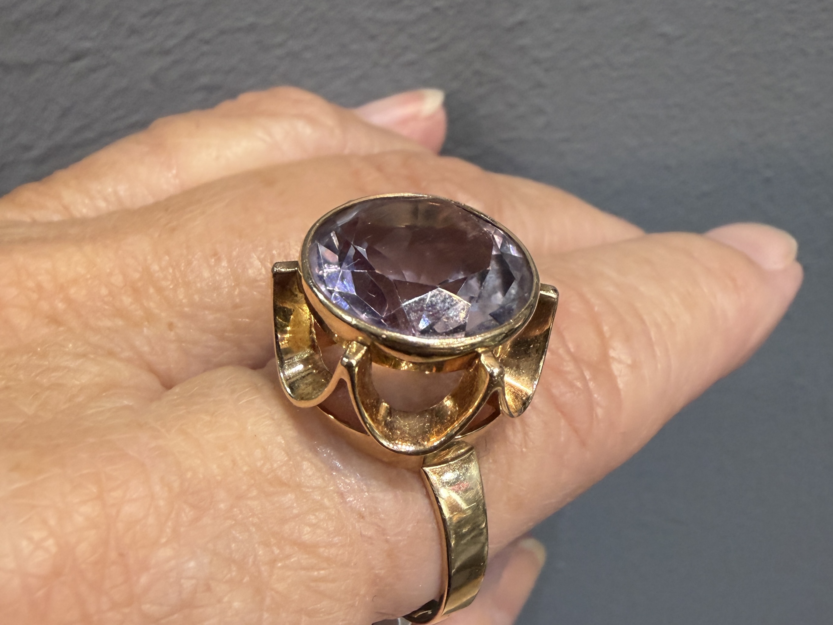 Discover the elegance of this 14k Gold and Amethyst cocktail ring, expertly designed by Niels Westerback in Finland circa 1970. A timeless piece that adds a touch of sophistication to any collection.