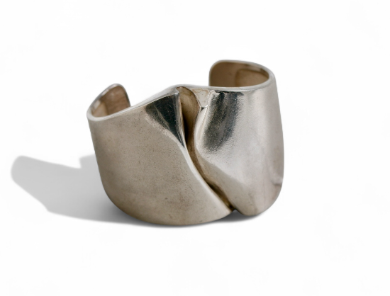 Discover the Igol Silver Cuff by Bjorn Weckstrom, a stunning piece of artisan jewelry that marries modern design with timeless elegance. Perfect for any occasion, this silver cuff adds a touch of sophistication to your style.