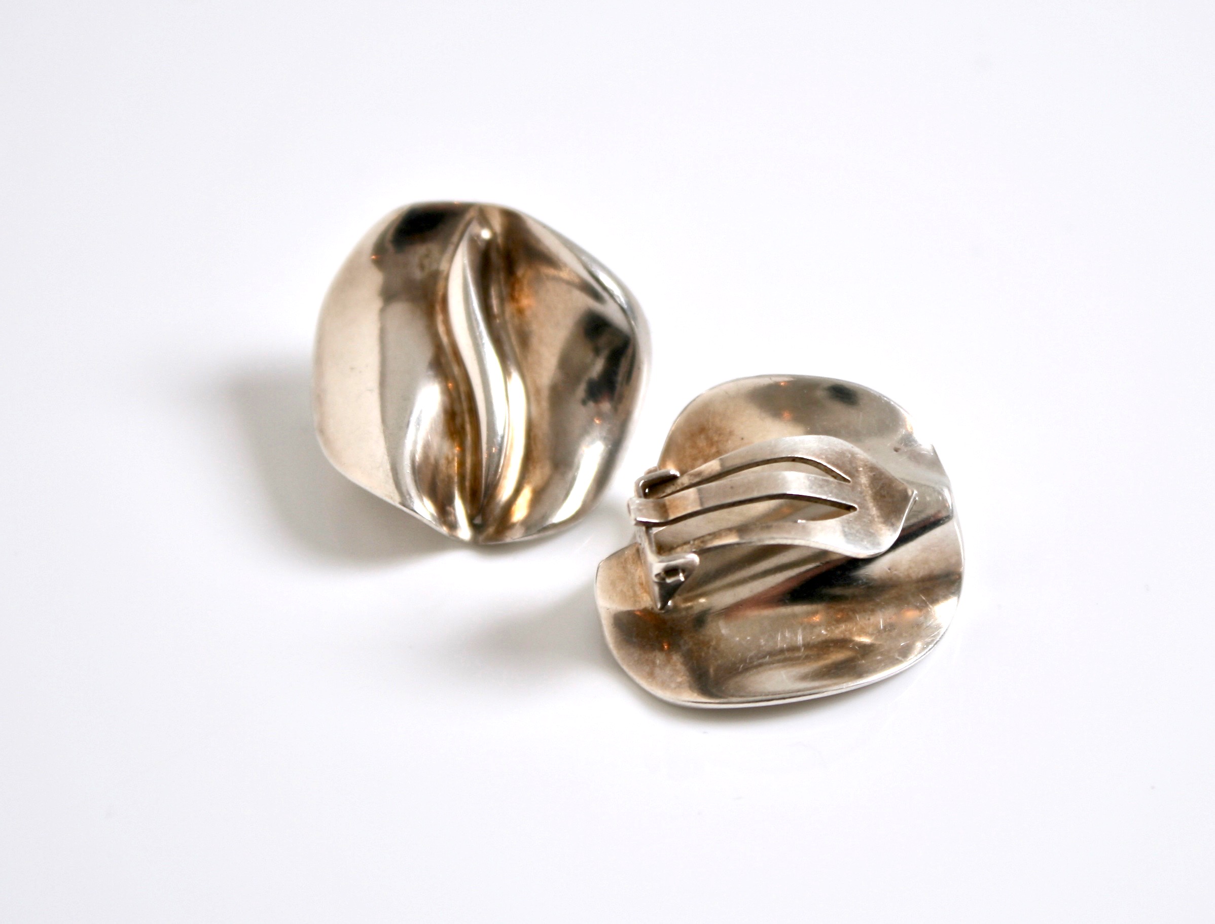 Discover the exquisite Georg Jensen Silver Clip Earrings, featuring a sophisticated design that embodies elegance and craftsmanship. Perfect for any occasion, these earrings add a touch of luxury to your style. Shop now!